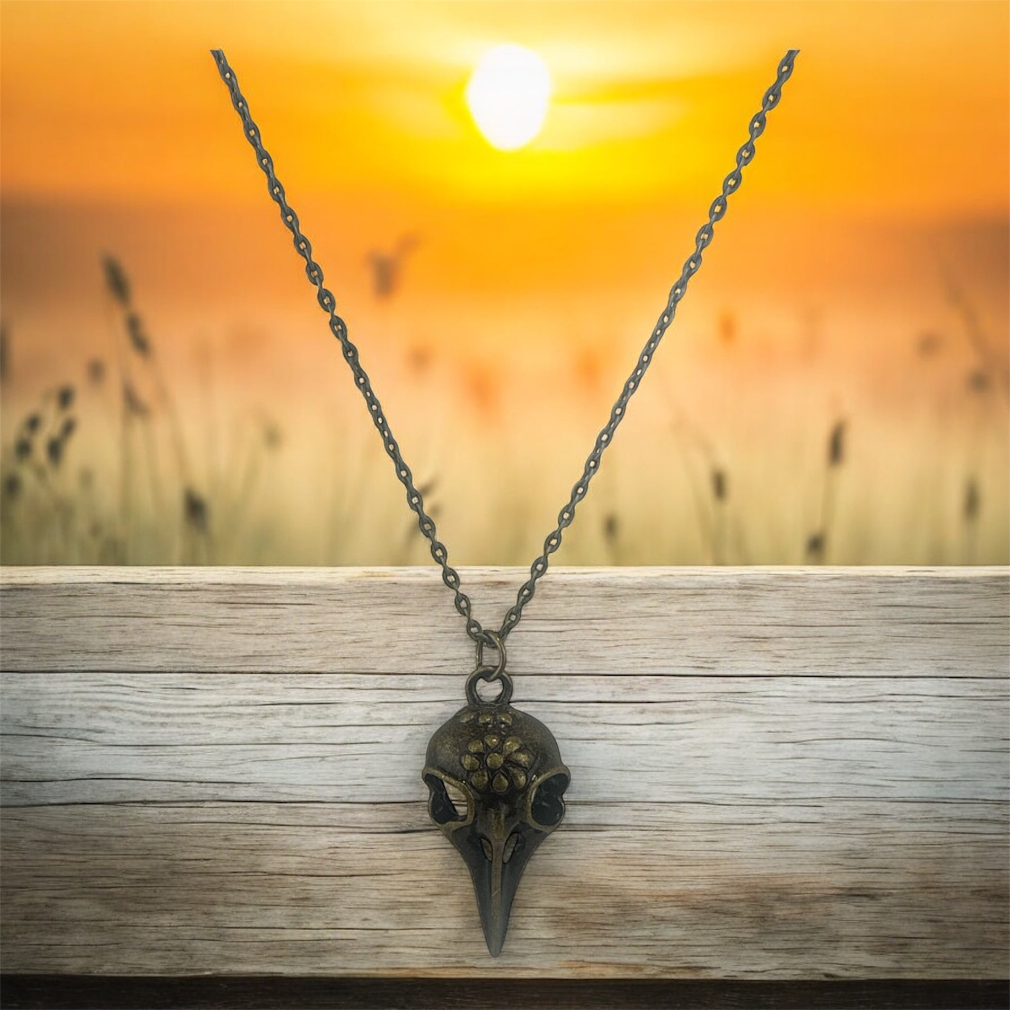 Bronze bird skull necklace